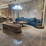 Luxury Teal Velvet Curved Sectional Sofa with Natural Wood Veneer Base & Branded Cushions